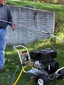 pressure washer on flat grass