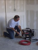 checking air compressor on flat surface